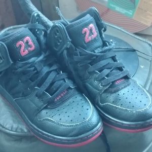 Nike Air Jordan high tops boys size 4. Black leather with red logos